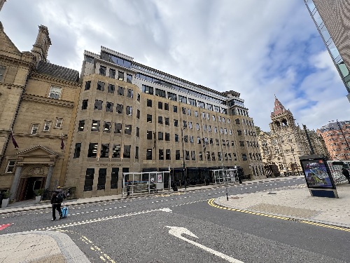 Display Energy Certificate assessor reviewing energy data for a public building in Leeds